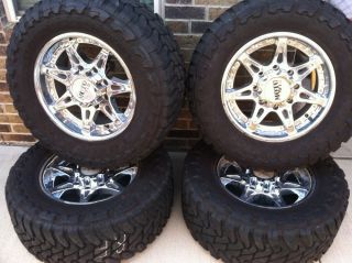 Moto Metal Chrome 18" Wheels and Toyo Open Country M T Tires 33x12 5X18R