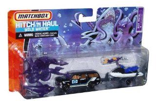 Matchbox Hitch 'N Haul MBX 164 Scale Die Cast Car Playset   Wild Water Set with Black Oceanic Research SUV Chevy Suburban, Jet Ski, Giant Squid, Shark and Scuba Diver Toys & Games